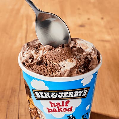 A pint of Topped Salted Caramel Brownie with bowls ready to serve